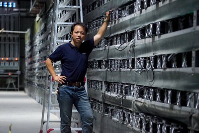 A large-scale mining farm showcases rows of mining rigs, emphasizing the organized and efficient environment characteristic of a well-managed hosting facility.